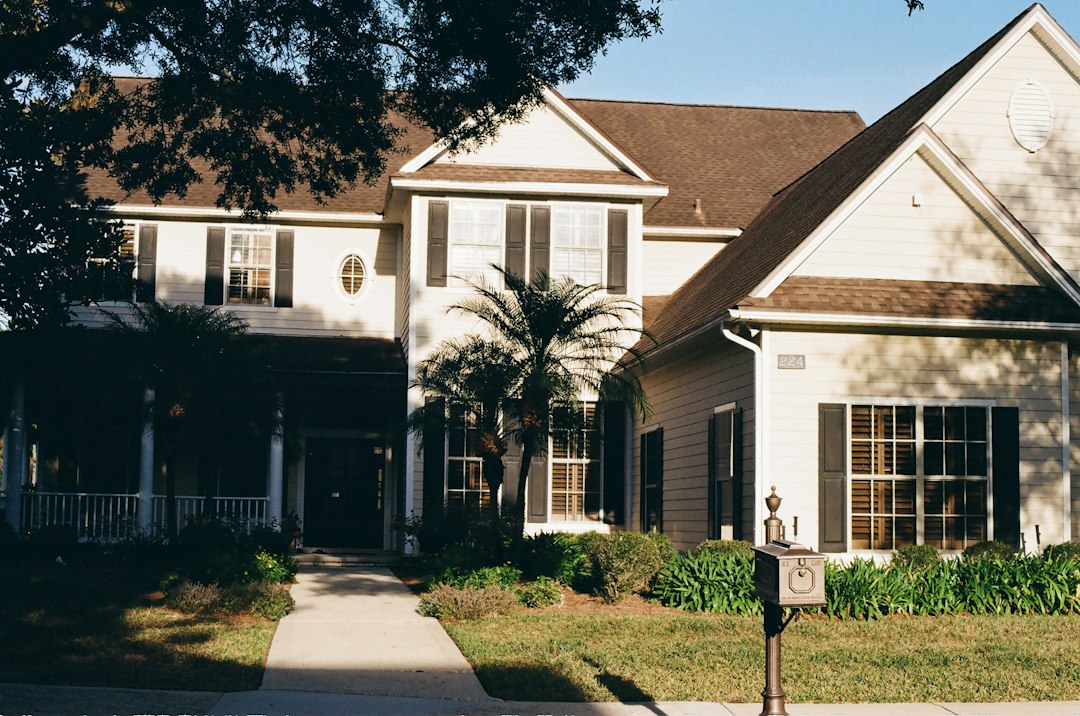A welcoming and affordable suburban house with a neat front porch and garden, representing smart housing choices.